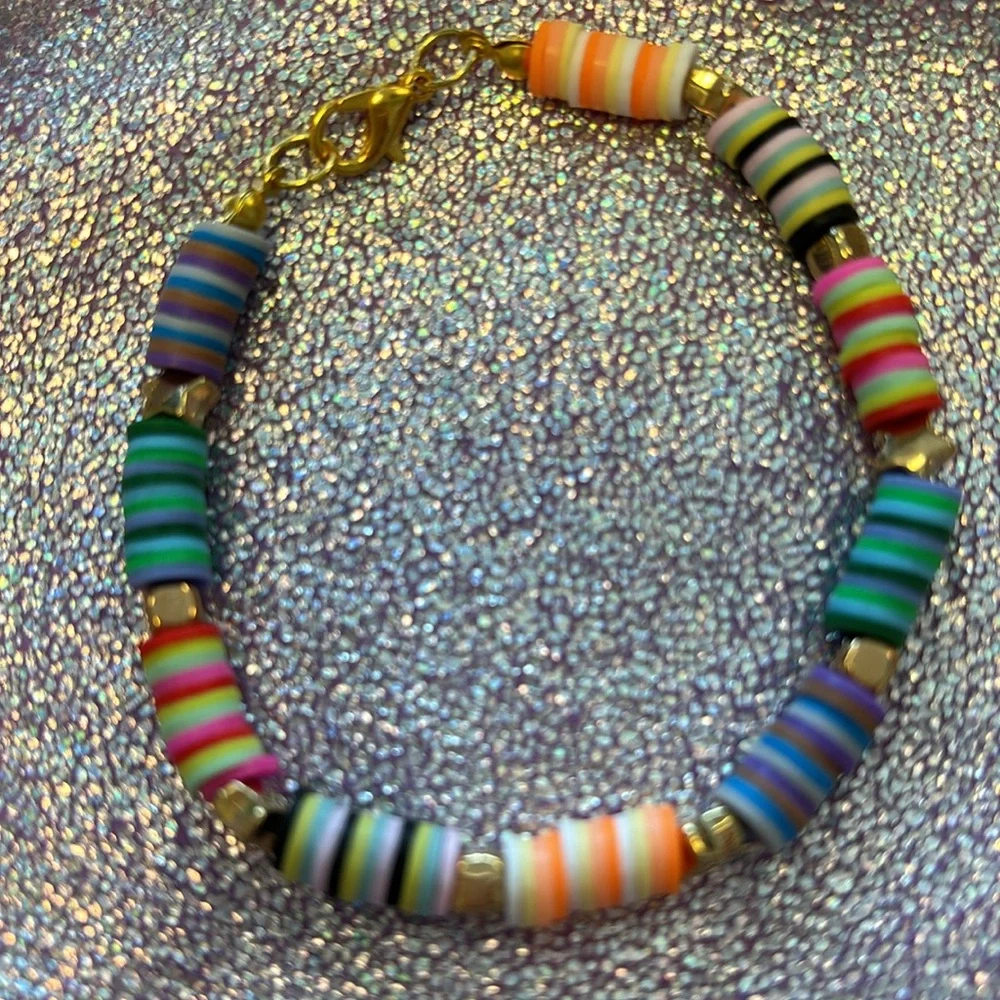 Girls multi colored clay beads bracelet with gold star and block charms. - Picture 3 of 6